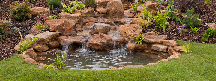 A local sandstone waterfall in a Dorset country garden