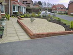 White of Witchampton - landscape gardener - A low maintenance garden with a path in Marshalls 'Saxon' paving.